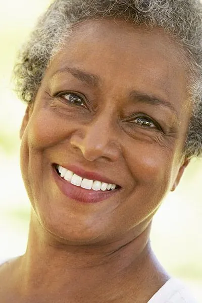 woman smiling with dental implants from Midtown Dental