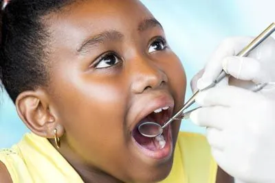 young child receiving a dental checkup at Midtown Dental in Raleigh, NC