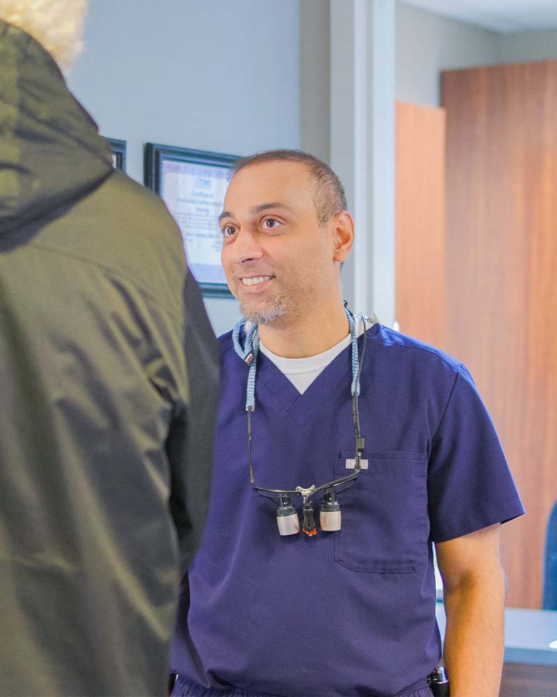Dr. Prajapati discussing periodontal care at Midtown Dental